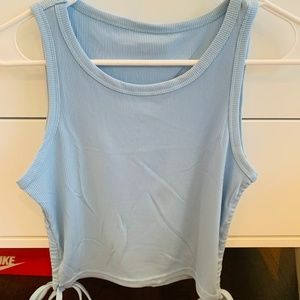 Womens XS Light blue cropped tank top with adjustable ties on the side.